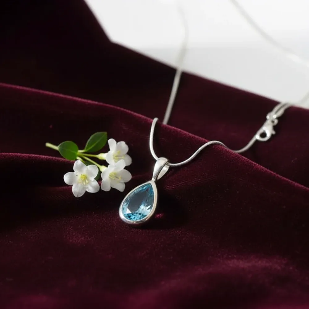 Blue Topaz Glow Teardrop Pendant